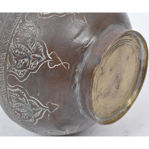 245 - A vintage 19th century Southeast Asian brass benares vase. Featuring Islamic style patterns decorate... 