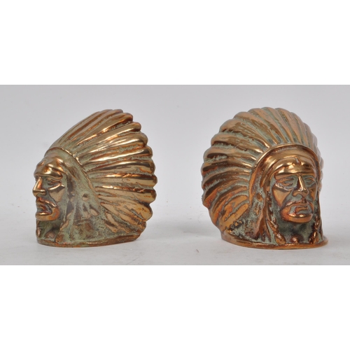 248 - Two vintage 20th century brass Native American book ends, both in the shape of a man's head wearing ... 