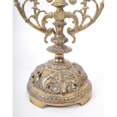 258 - A brass candelabrum / candle holder for three candles. 19th century, French origin with floral and d... 