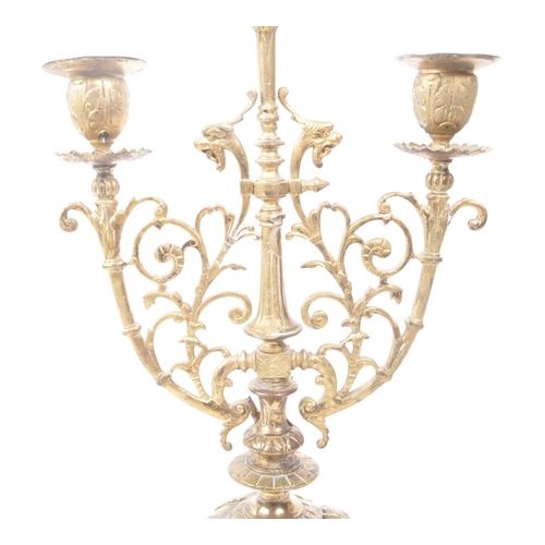 258 - A brass candelabrum / candle holder for three candles. 19th century, French origin with floral and d... 