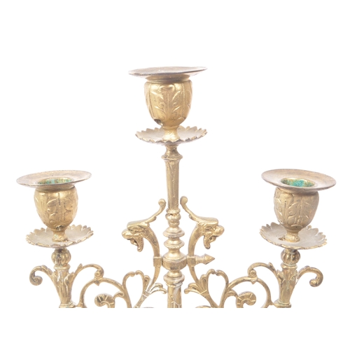 258 - A brass candelabrum / candle holder for three candles. 19th century, French origin with floral and d... 