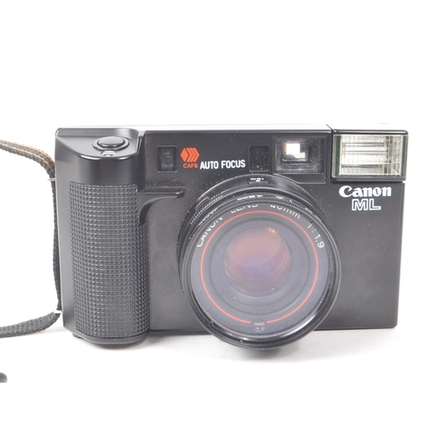 261 - A vintage 1980s Canon AF35ML 35mm compact point-and-shoot camera. Including lens cap and camera case... 