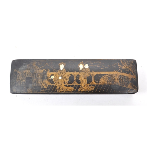 262 - A vintage 20th century Chinese lacquered wooden pen box, featuring gilt decoration to the hinged lid... 