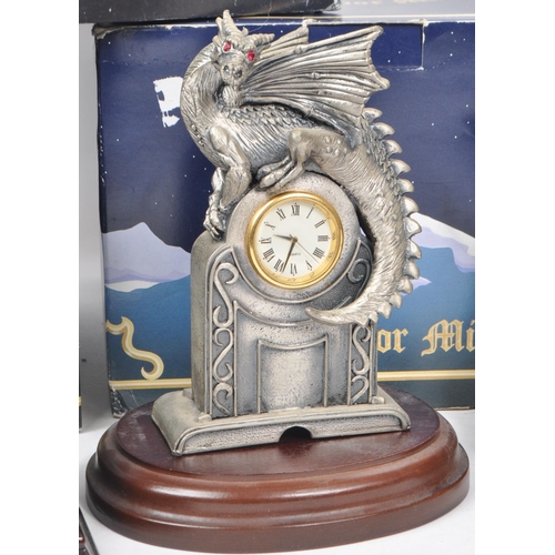 265 - Myth & Magic by The Tudor Mint - Four modern cast pewter statue dragon figurines. To include The... 