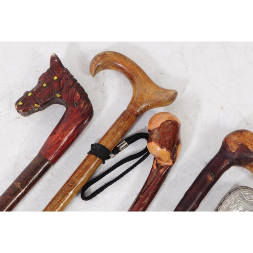 268 - Collection of vintage 20th century hand made walking sticks / swagger canes. Including wooden horse ... 