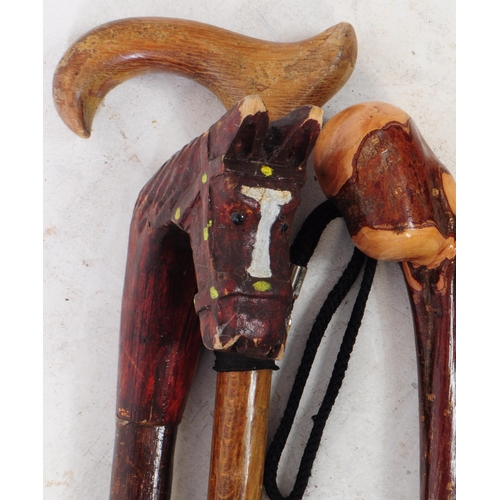 268 - Collection of vintage 20th century hand made walking sticks / swagger canes. Including wooden horse ... 