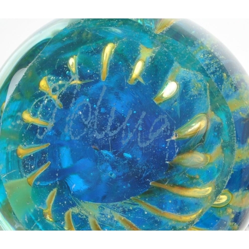 27 - Large collection of glass paperweights, to include brands such as Caithness, Dartington, Mdina and o... 