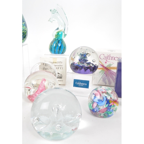 27 - Large collection of glass paperweights, to include brands such as Caithness, Dartington, Mdina and o... 