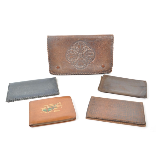 290 - A collection of five vintage 20th century leather and suede wallets. Featuring one with snake skin p... 