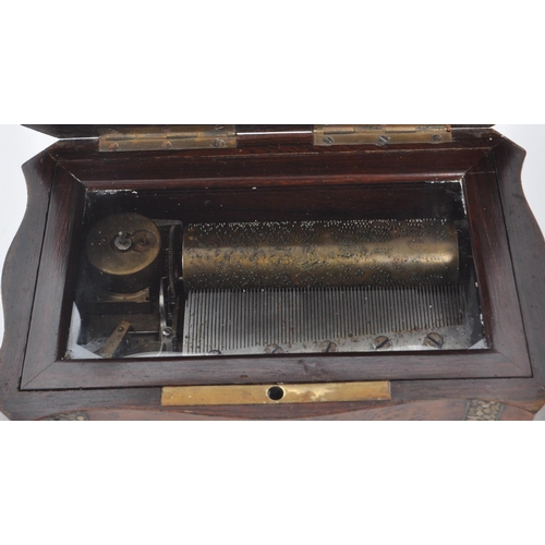 297 - A 19th century walnut musical box inlaid with mother of pearl. Cylinder type mechanics, comb fully i... 