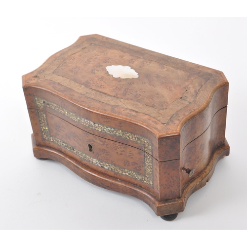 297 - A 19th century walnut musical box inlaid with mother of pearl. Cylinder type mechanics, comb fully i... 