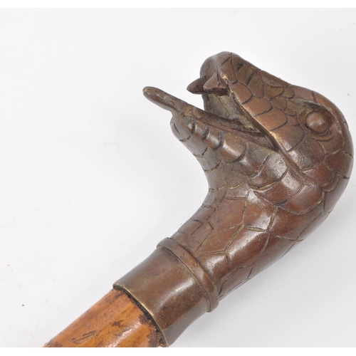 302 - A vintage (possibly 19th century) bronze snake head handle walking stick.
33