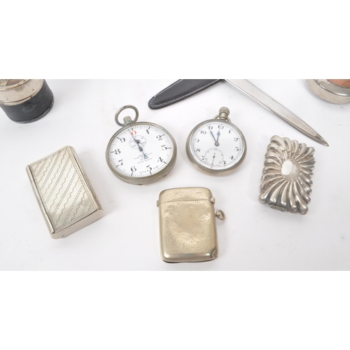 303 - A collection of 20th century metal travel pocket items. The collection to include two pocket watches... 