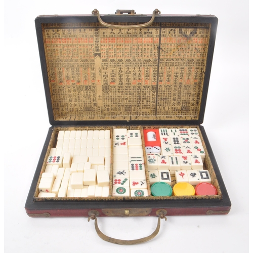 304 - A vintage mahjong game set with decorative case, 1960s-1980s approximate origin. Contains plastic ti... 