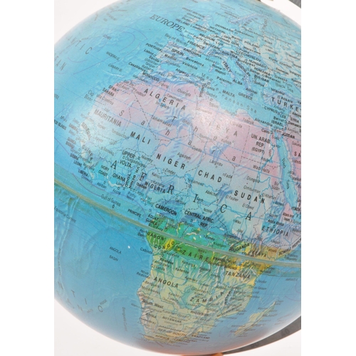 306 - A 1960s globe. Set with an orange stand and brass fitting, with printed topographical distinctions o... 