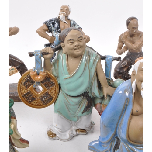 31 - Large collection of Chinese figurines, mostly comprising of mud men, action figures, female figures ... 