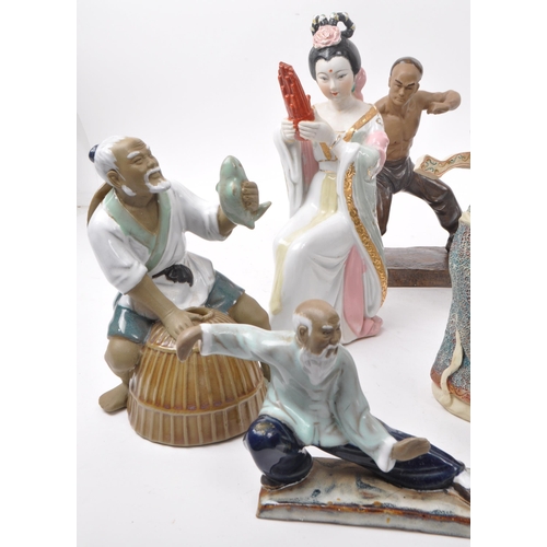 31 - Large collection of Chinese figurines, mostly comprising of mud men, action figures, female figures ... 