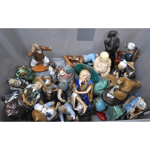 31 - Large collection of Chinese figurines, mostly comprising of mud men, action figures, female figures ... 