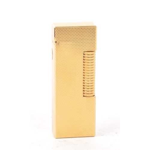 310 - Dunhill - A vintage 20th century Dunhill Rollagas rolled gold plated lighter. The lighter having eng... 