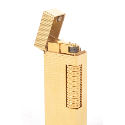 310 - Dunhill - A vintage 20th century Dunhill Rollagas rolled gold plated lighter. The lighter having eng... 