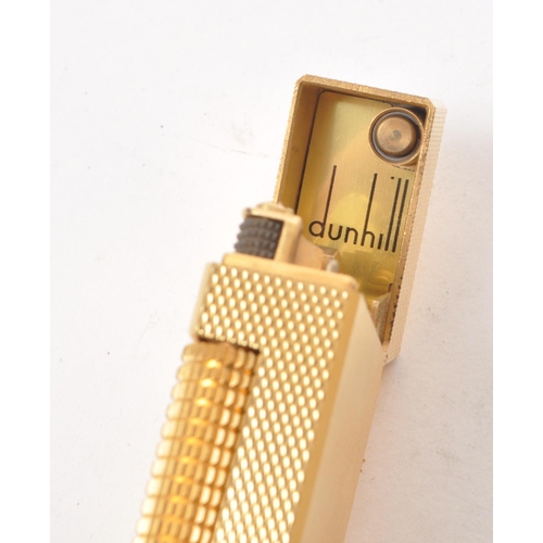 310 - Dunhill - A vintage 20th century Dunhill Rollagas rolled gold plated lighter. The lighter having eng... 