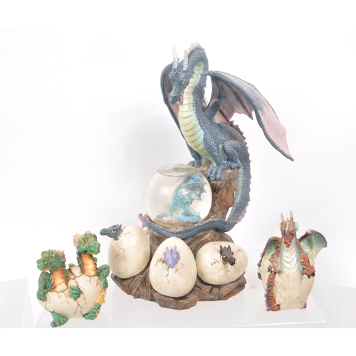 317 - A large collection of contemporary resin dragon figures, mostly depicting dragons hatching out of eg... 