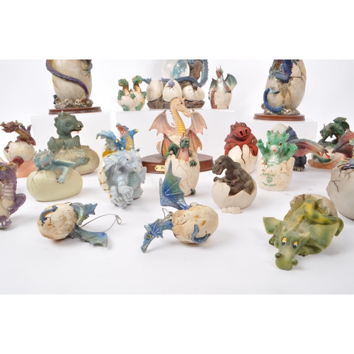 317 - A large collection of contemporary resin dragon figures, mostly depicting dragons hatching out of eg... 