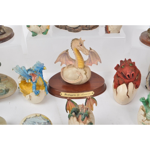 317 - A large collection of contemporary resin dragon figures, mostly depicting dragons hatching out of eg... 