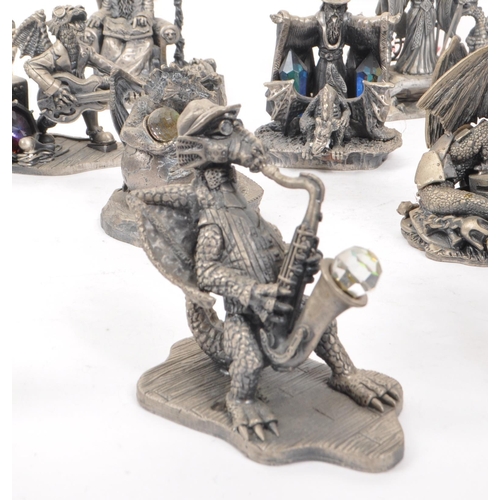 318 - Myth & Magic by The Tudor Mint - A collection of 24 early 21st century cast pewter statue dragon... 