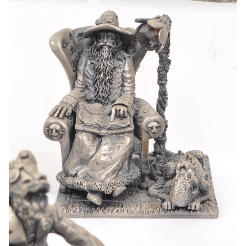 318 - Myth & Magic by The Tudor Mint - A collection of 24 early 21st century cast pewter statue dragon... 