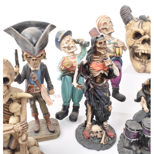 325 - A large collection of 21st century skeleton resin / plastic figures, to include: bobble head skeleto... 