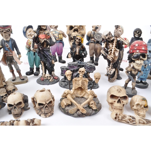 325 - A large collection of 21st century skeleton resin / plastic figures, to include: bobble head skeleto... 