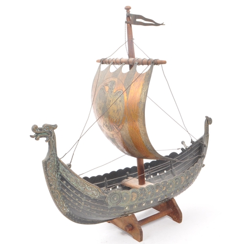 331 - A vintage 1970s believed to be Danish Iron Art patinated bronze Viking boat on a wooden stand, by Ed... 