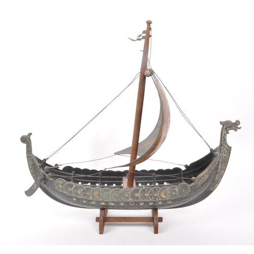 331 - A vintage 1970s believed to be Danish Iron Art patinated bronze Viking boat on a wooden stand, by Ed... 