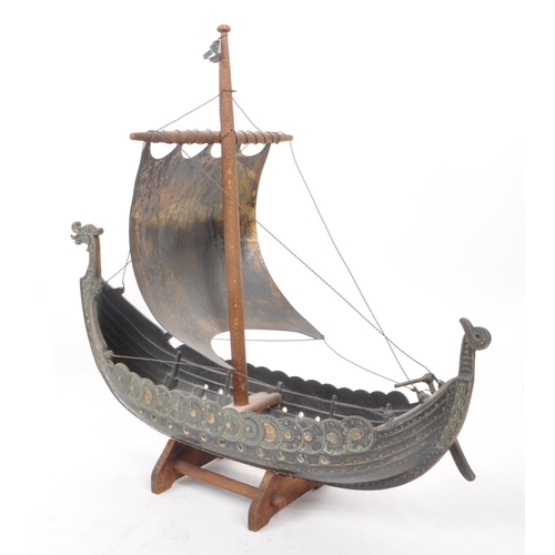 331 - A vintage 1970s believed to be Danish Iron Art patinated bronze Viking boat on a wooden stand, by Ed... 