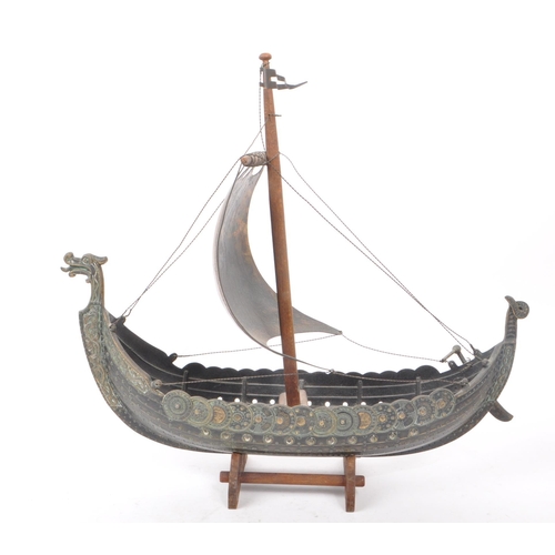 331 - A vintage 1970s believed to be Danish Iron Art patinated bronze Viking boat on a wooden stand, by Ed... 