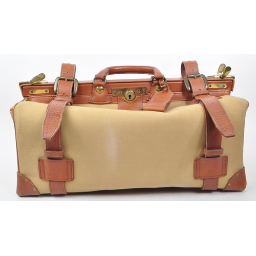 332 - Swaine Adeney Brigg - A vintage 20th century Swaine Adeney Brigg canvas and leather large coach / gl... 