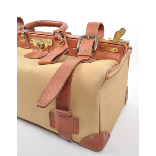 332 - Swaine Adeney Brigg - A vintage 20th century Swaine Adeney Brigg canvas and leather large coach / gl... 