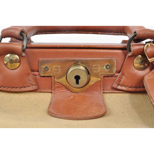 332 - Swaine Adeney Brigg - A vintage 20th century Swaine Adeney Brigg canvas and leather large coach / gl... 