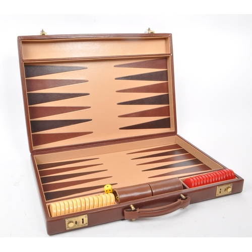 342 - Asprey - A vintage late 20th century circa 1990s leather backgammon attache / briefcase. The case ha... 