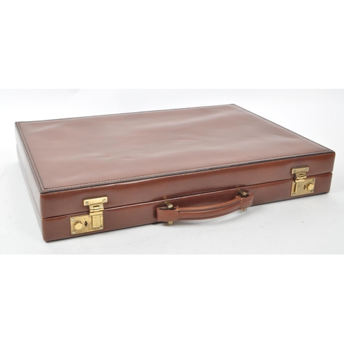 342 - Asprey - A vintage late 20th century circa 1990s leather backgammon attache / briefcase. The case ha... 