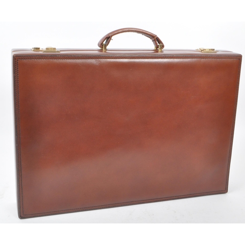 342 - Asprey - A vintage late 20th century circa 1990s leather backgammon attache / briefcase. The case ha... 