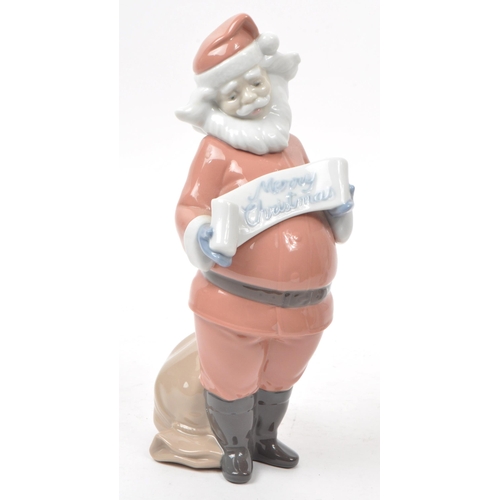 35 - Nao - Lladro - Two contemporary Spanish porcelain christmas figurines, comprising of: a 2000 no. 139... 