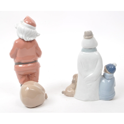 35 - Nao - Lladro - Two contemporary Spanish porcelain christmas figurines, comprising of: a 2000 no. 139... 