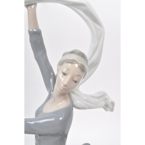 36 - Nao - Lladro - Three contemporary late 20th century porcelain dancer figurines, comprising of two ba... 