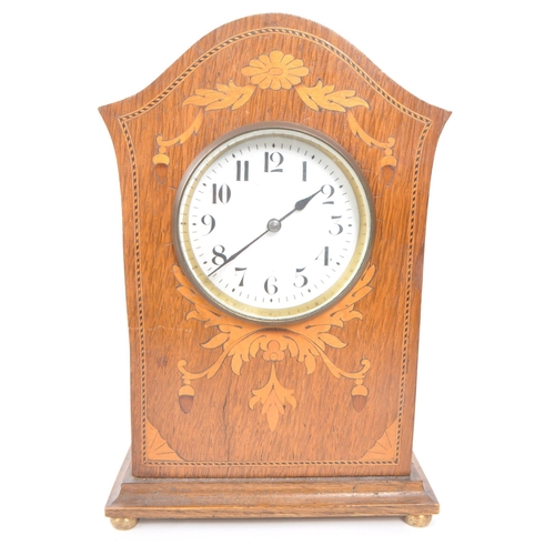 364 - Two Edwardian inlaid mahogany mantel clocks. One example with white face ebonised Roman numeral chap... 