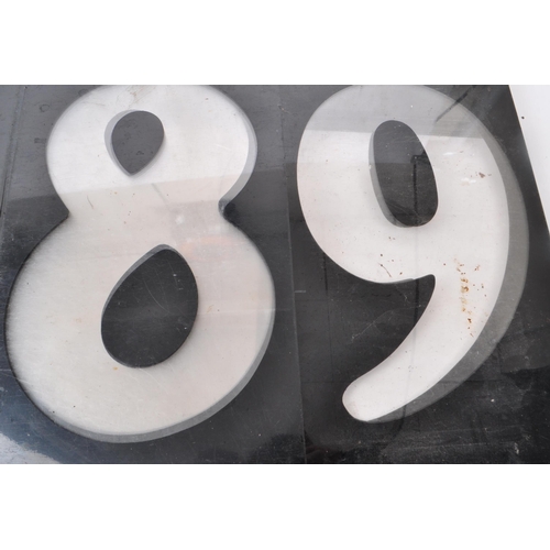 367 - A vintage set of plastic petrol station number slides, in black with the numbers being transparent. ... 