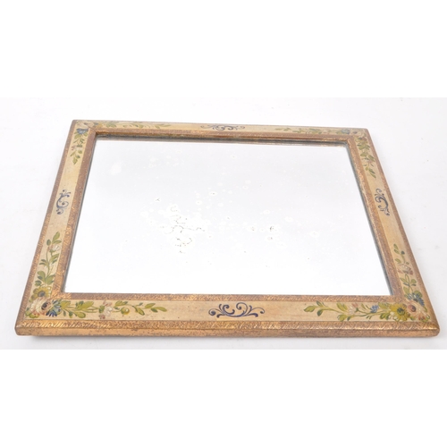 370 - A vintage early 20th-century hand-painted wall hanging mirror, in rectangular form. Featuring two gi... 