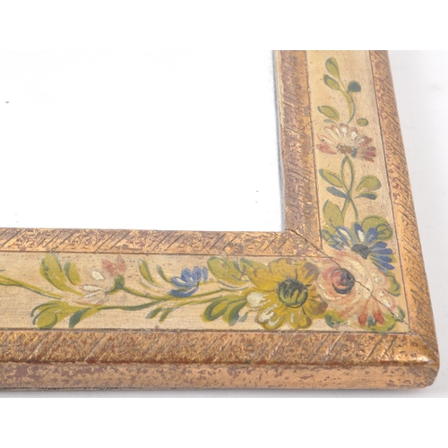 370 - A vintage early 20th-century hand-painted wall hanging mirror, in rectangular form. Featuring two gi... 