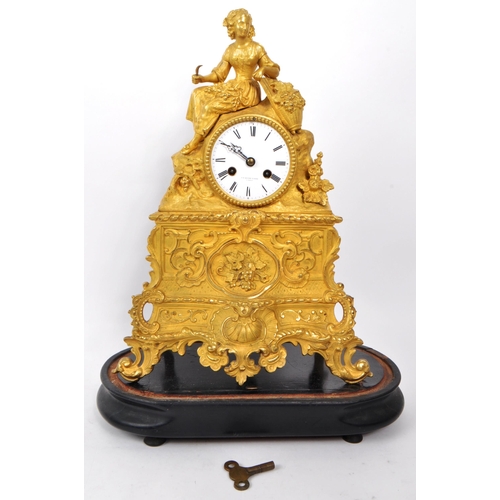 382 - A B Savory & Sons - A 19th-century vintage ormolu mantel clock, with a glass dome and key, raise... 